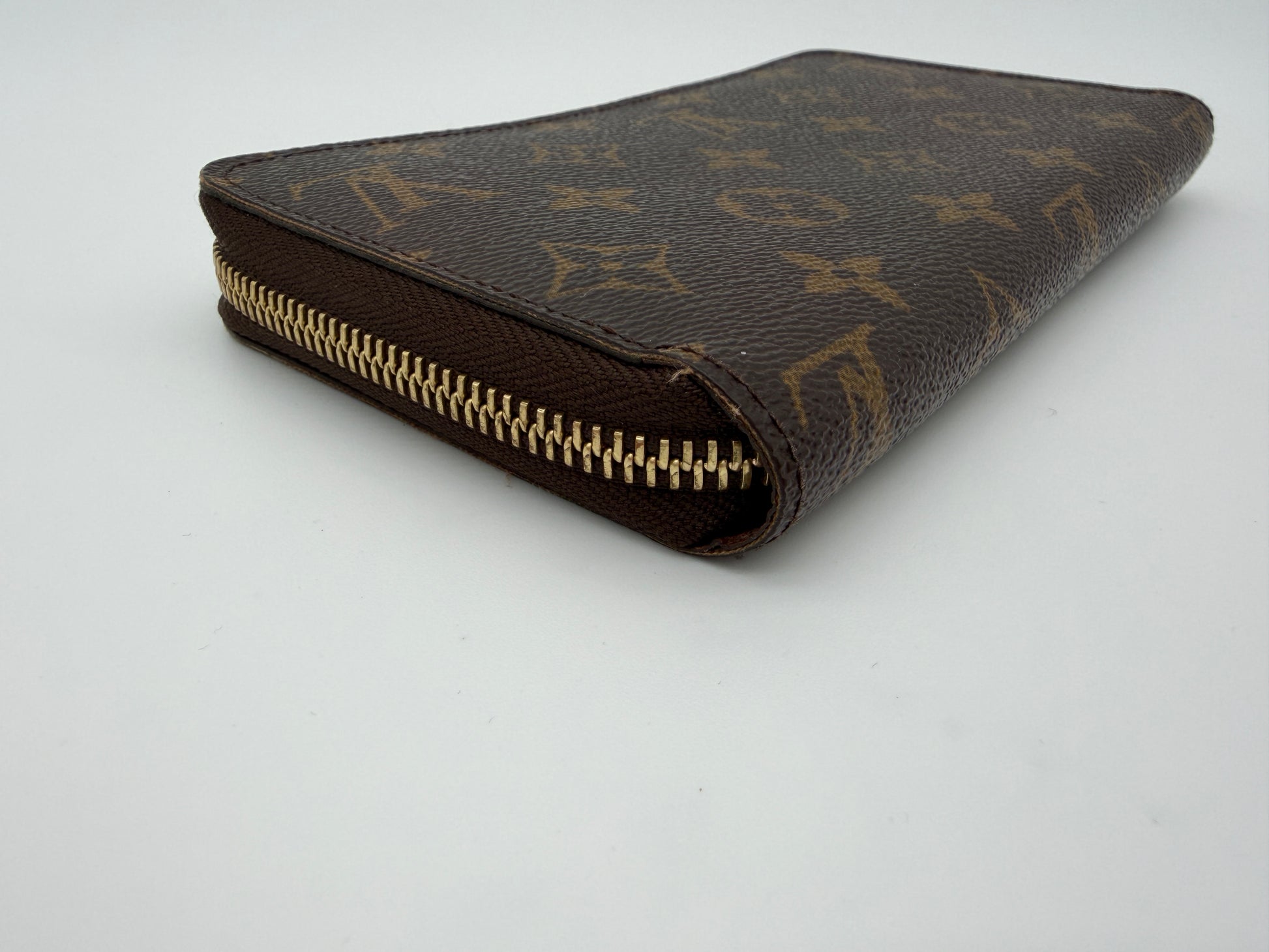 Louis Vuitton Monogram Zippy Wallet.