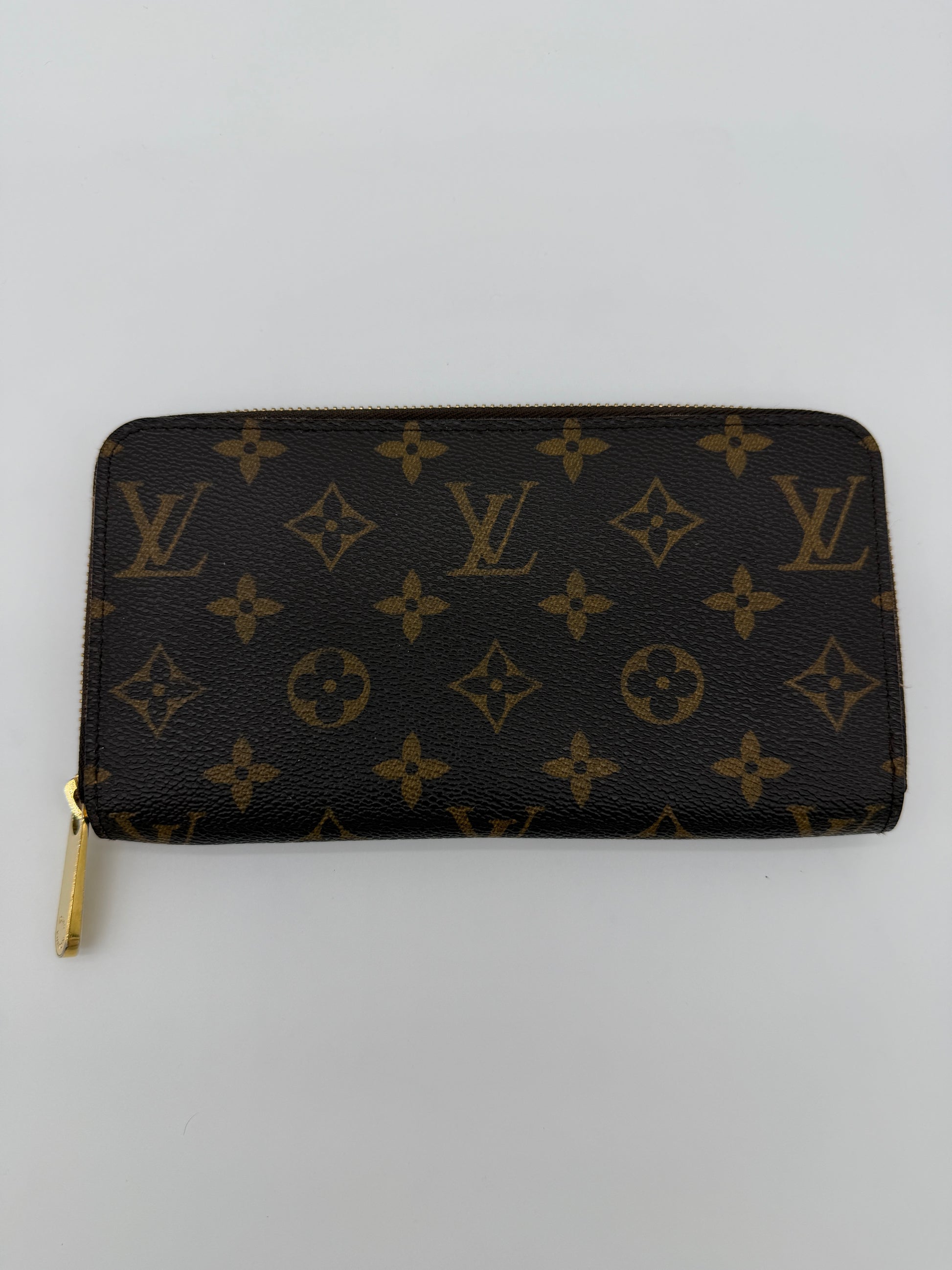 Louis Vuitton Monogram Zippy Wallet.