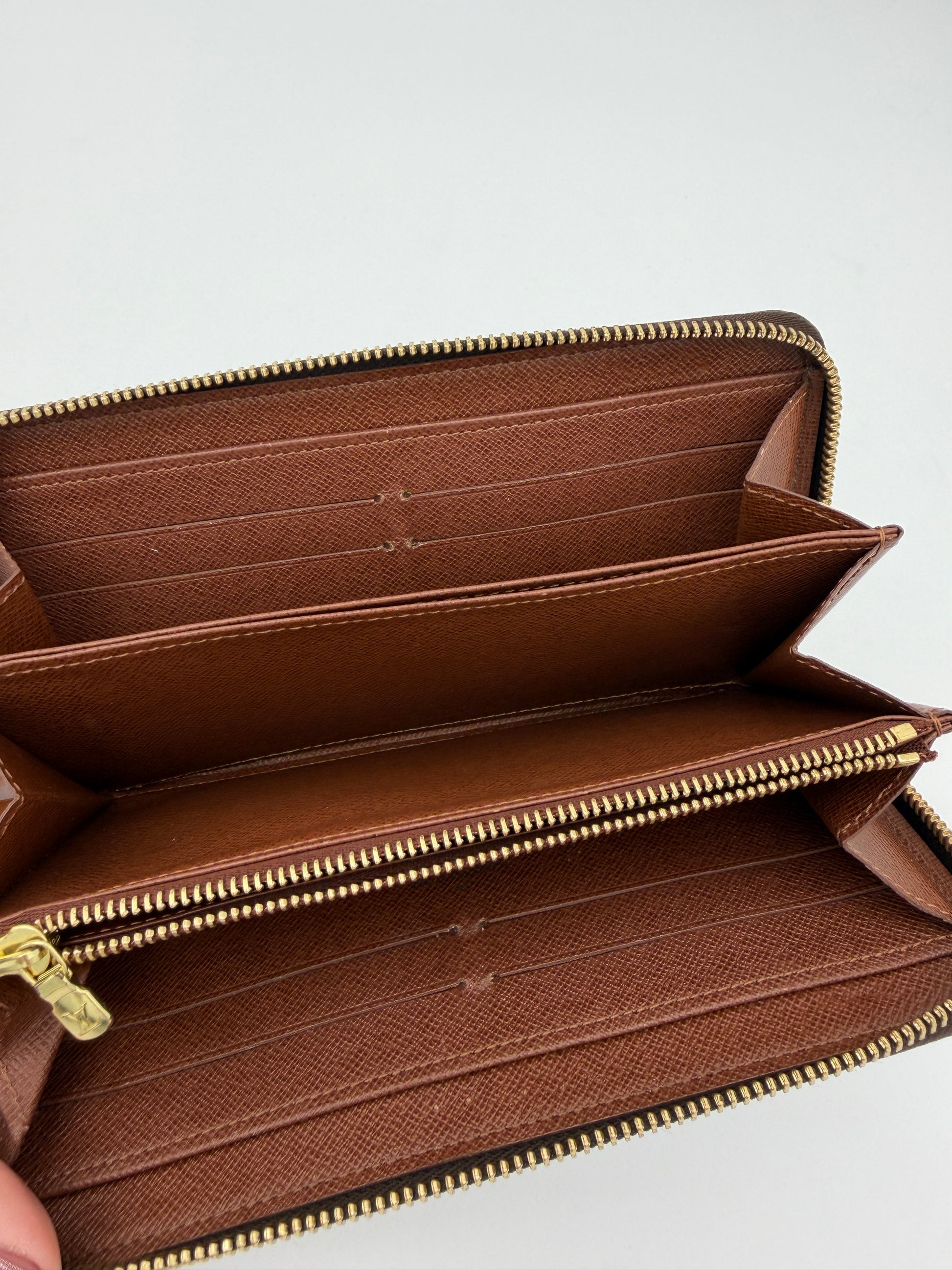 Louis Vuitton Monogram Zippy Wallet.