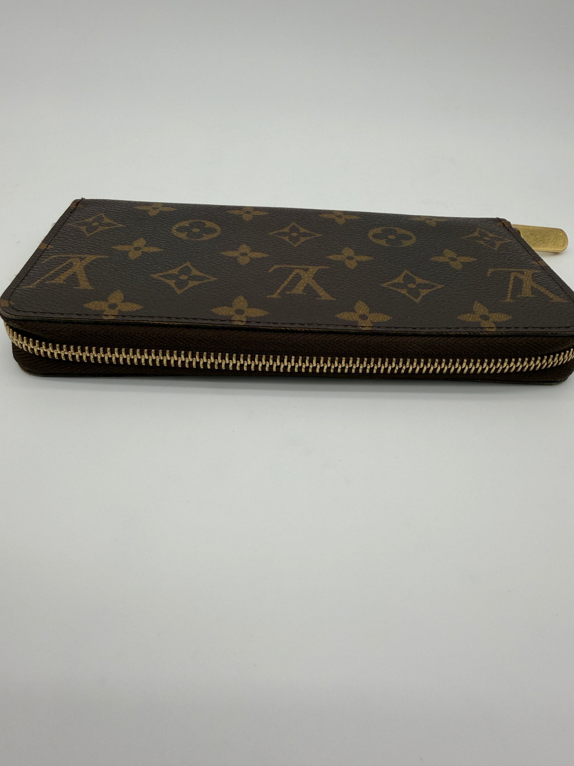 Louis Vuitton Monogram Zippy Wallet.
