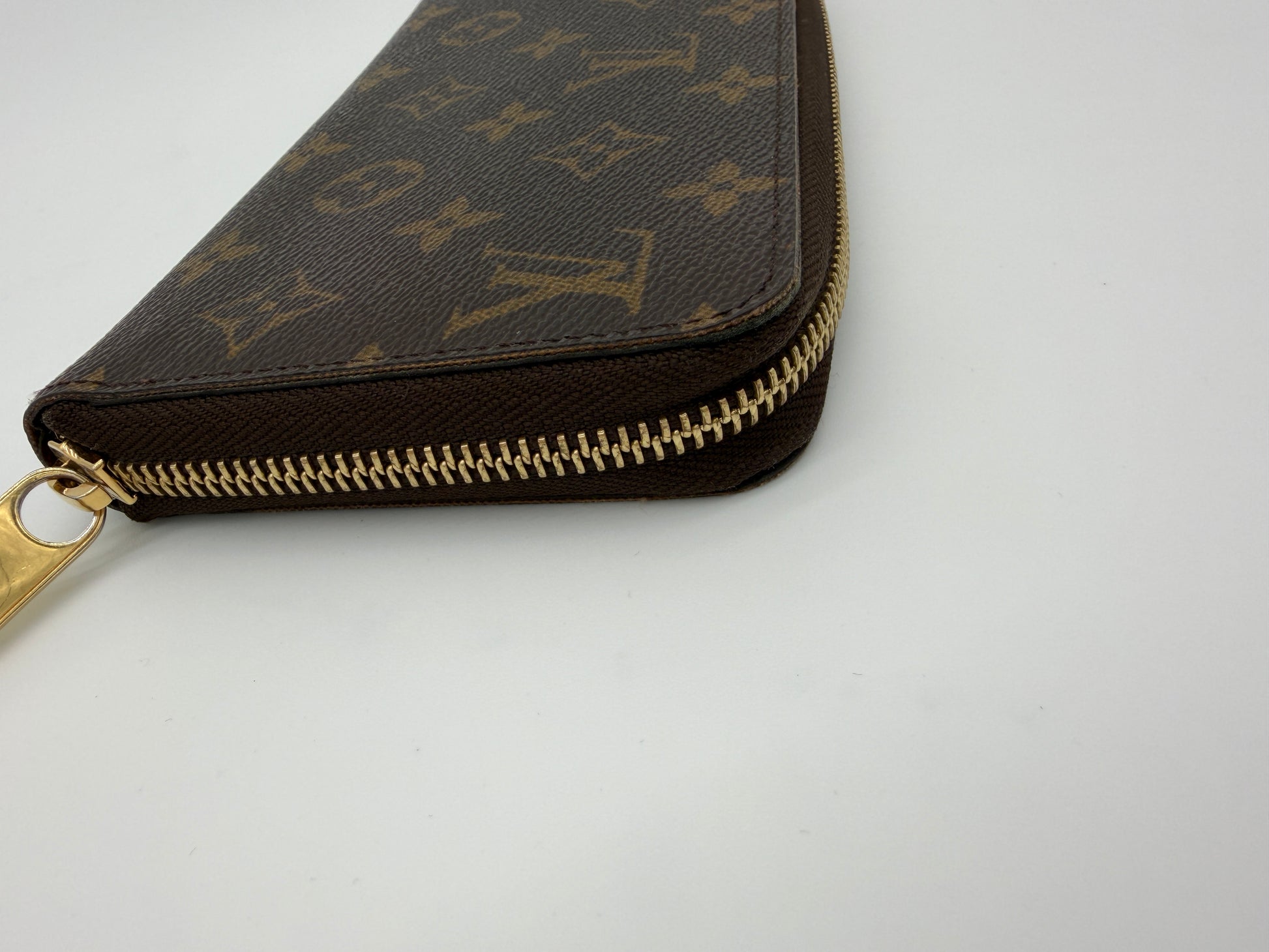 Louis Vuitton Monogram Zippy Wallet.