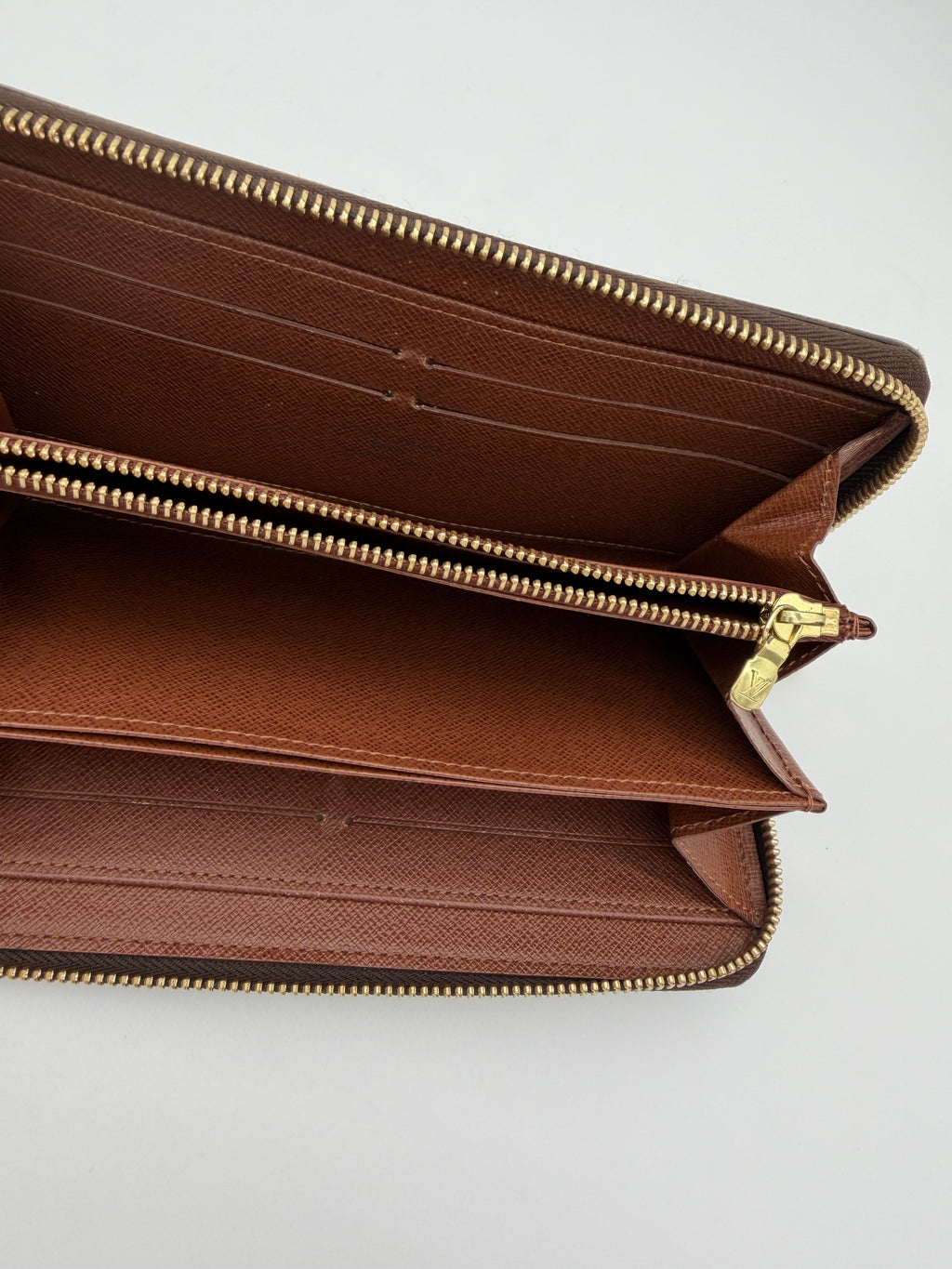Louis Vuitton Monogram Zippy Wallet.