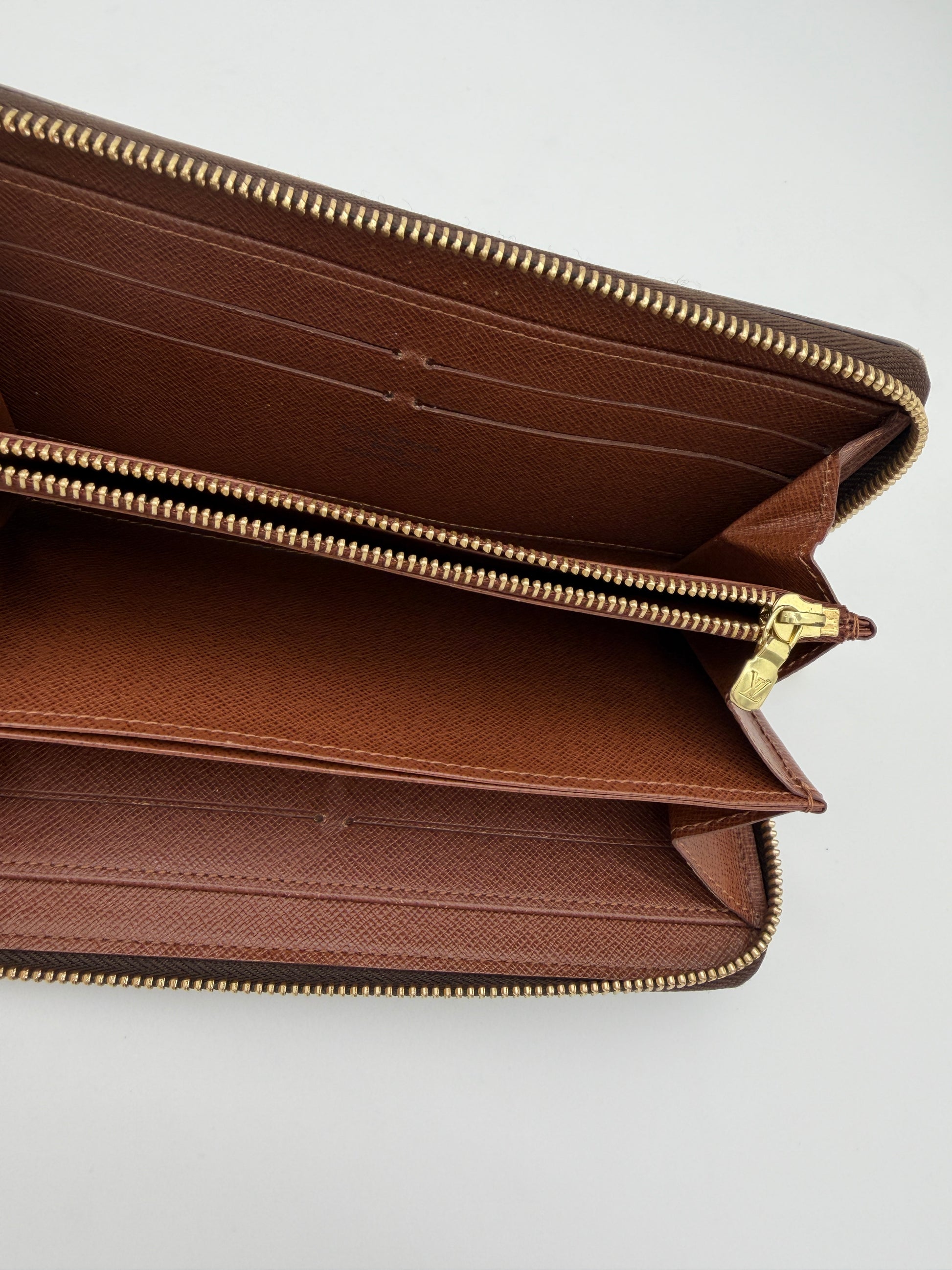 Louis Vuitton Monogram Zippy Wallet.