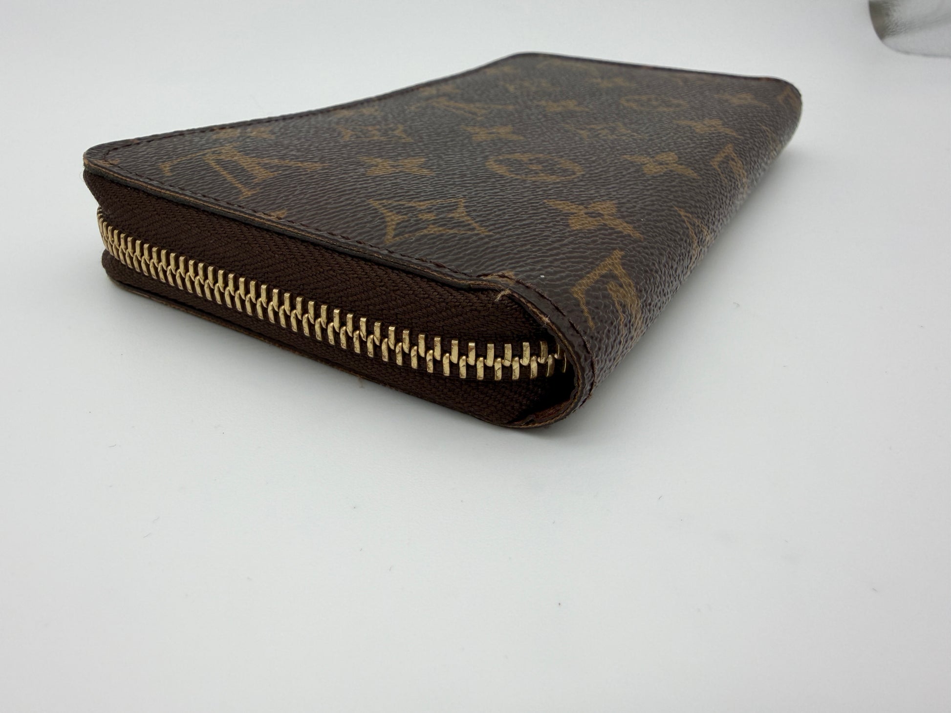 Louis Vuitton Monogram Zippy Wallet.