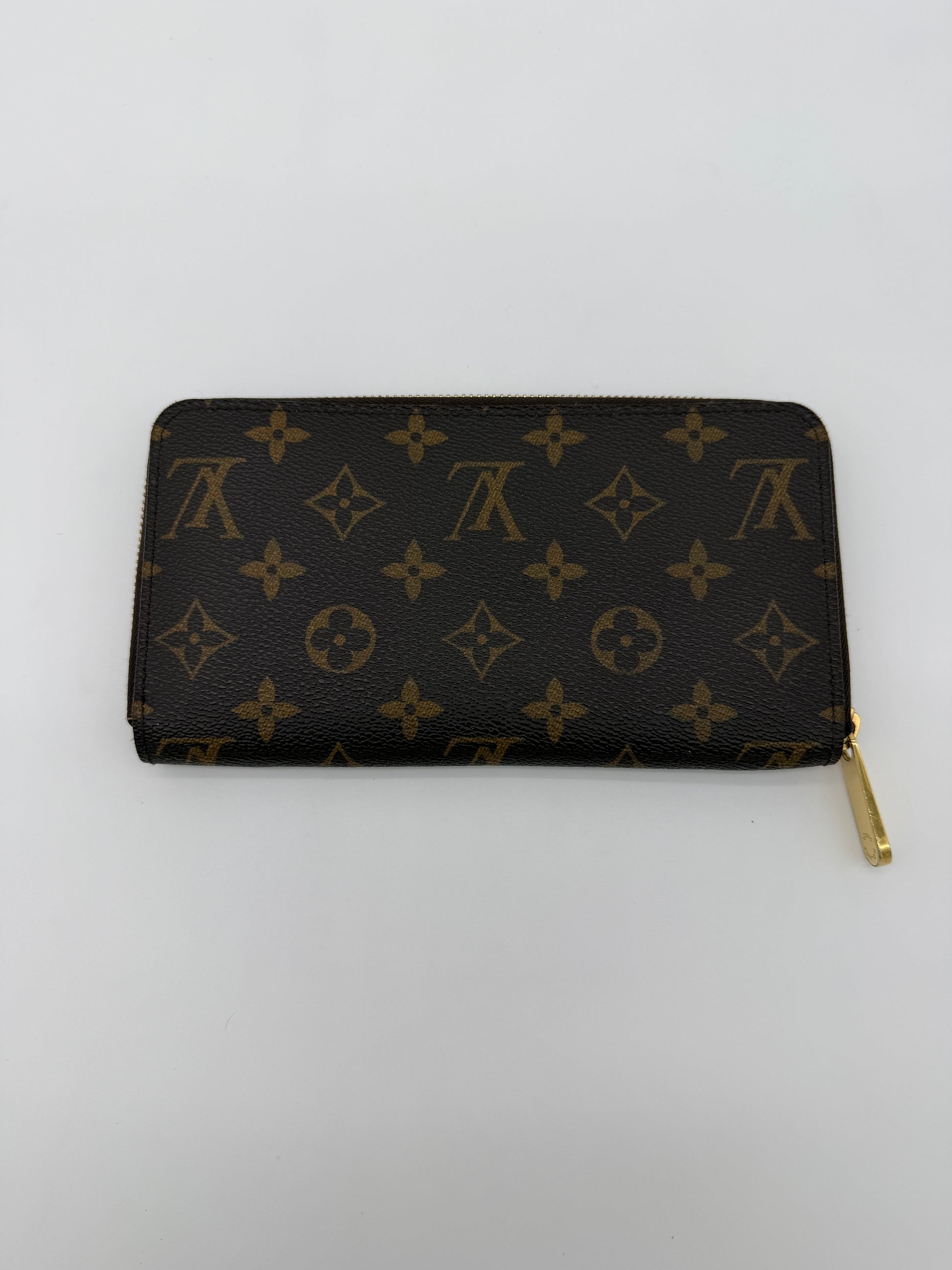 Louis Vuitton Monogram Zippy Wallet.